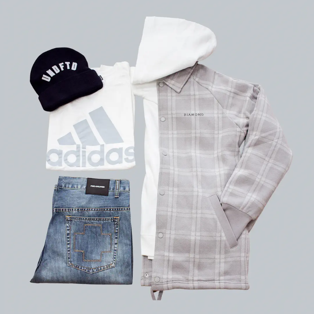  a picture of a a grey and white jacket with a white adidas shirt, black hat and blue jeans